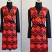 1960s turtleneck dress. Vintage, tribal mod and autumn cozy. Black, orange, pink. Comes with a belt. Size M