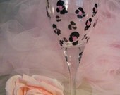 painted birthday or bridesmaid wine glass with pink leopard design can be personalized and customzed