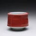porcelain cup, chawan, tea bowl with bright red and turquoise celadon glazes