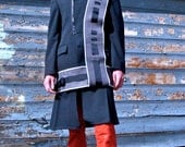 long navy jacket with gray belts