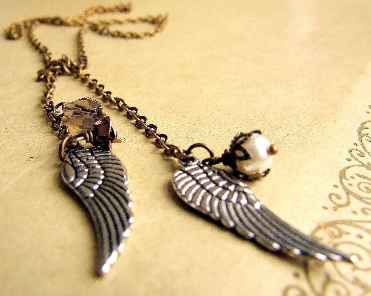 Antiqued brass angel wings lariat charm necklace, silver wings, small charms, bird wing jewelry