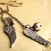 Antiqued brass angel wings lariat charm necklace, silver wings, small charms, bird wing jewelry