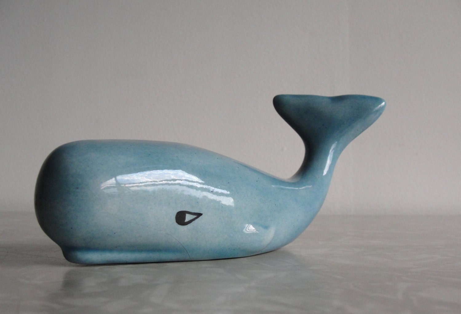 whale tail figurine