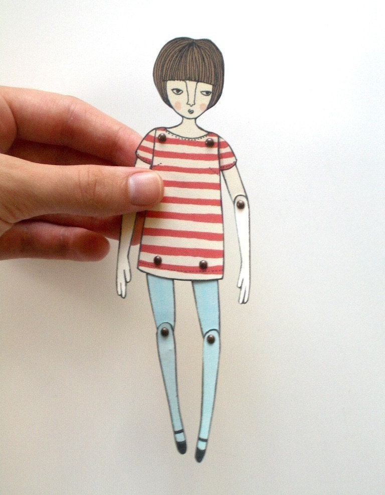 miniature moveable paper doll (in red stripes)