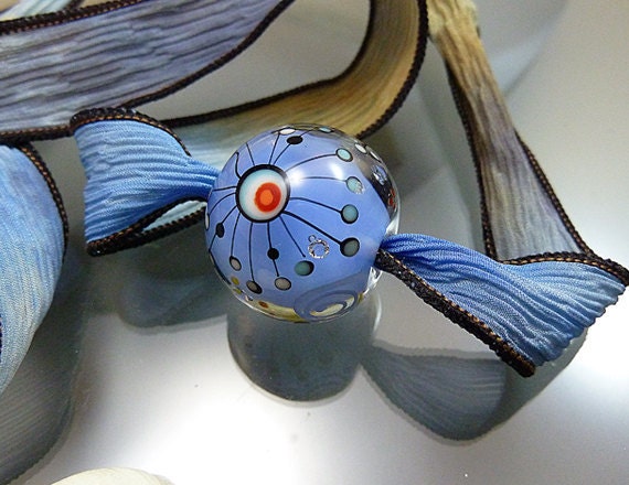 Melanie Moertel Lampwork Beads - Round blue glass focal bead with satellites, strung on a hand dyed silk ribbon - "Space Ball"