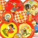 50s Tin Toy tea saucers, Animals & kids set of 12 with litho in reds, Instant Collection.