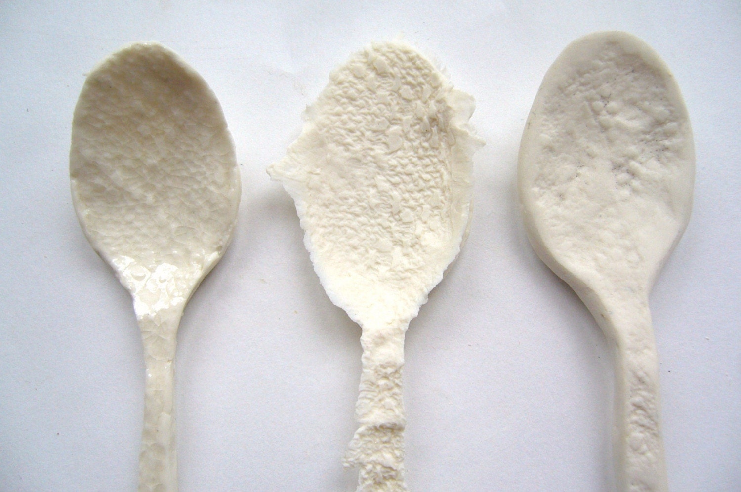 A set of 3 unique decorative handmade porcelain spoons