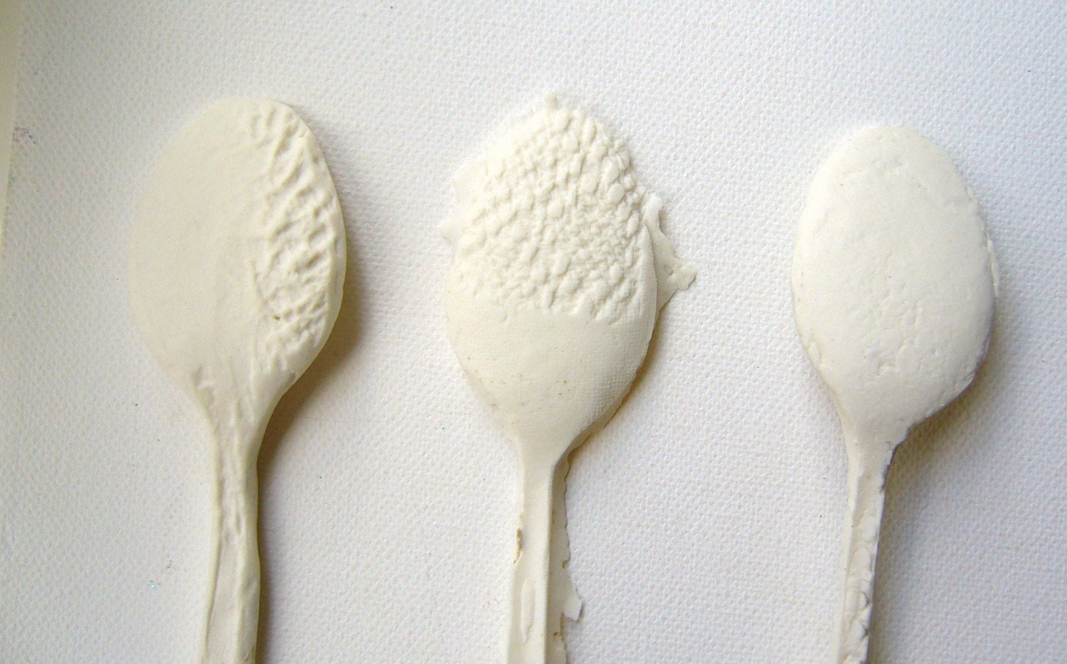 A set of 3 unique decorative handmade porcelain spoons