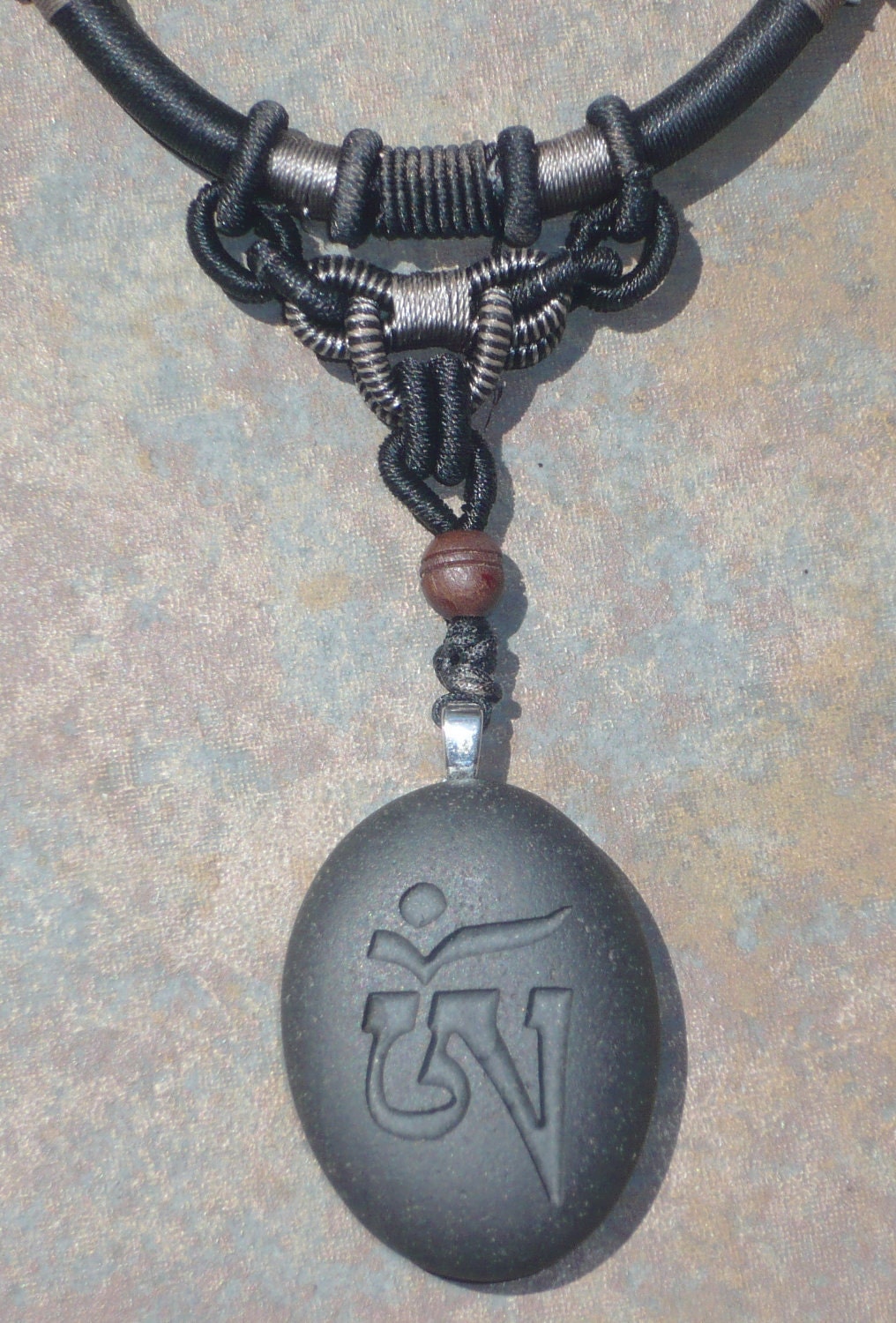 black chinese silk cord necklace w.tibetan OM pendant