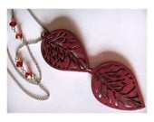 Carved Filigree Wood Leaf Necklace in Shimmering Burgundy with Antique Silver Chain