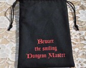 Dungeons and Dragons game dice Beware Smiling DM bag
