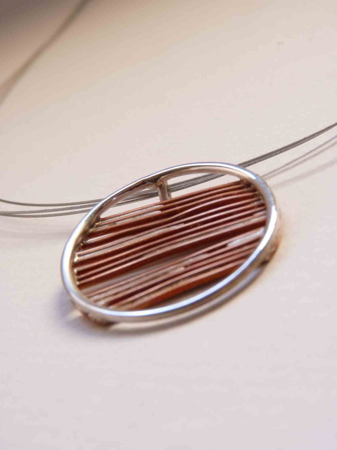 Necklace round of an inch, copper and sterling silver Asymmetrical sticks. Minimalist design, simple to use all day