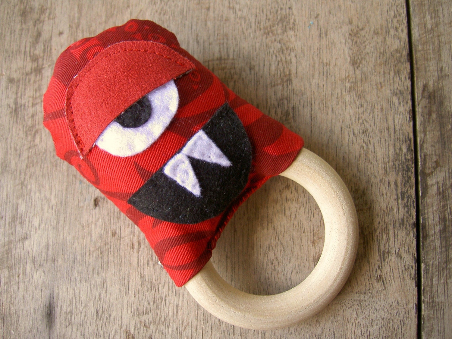 funky red rattle monster