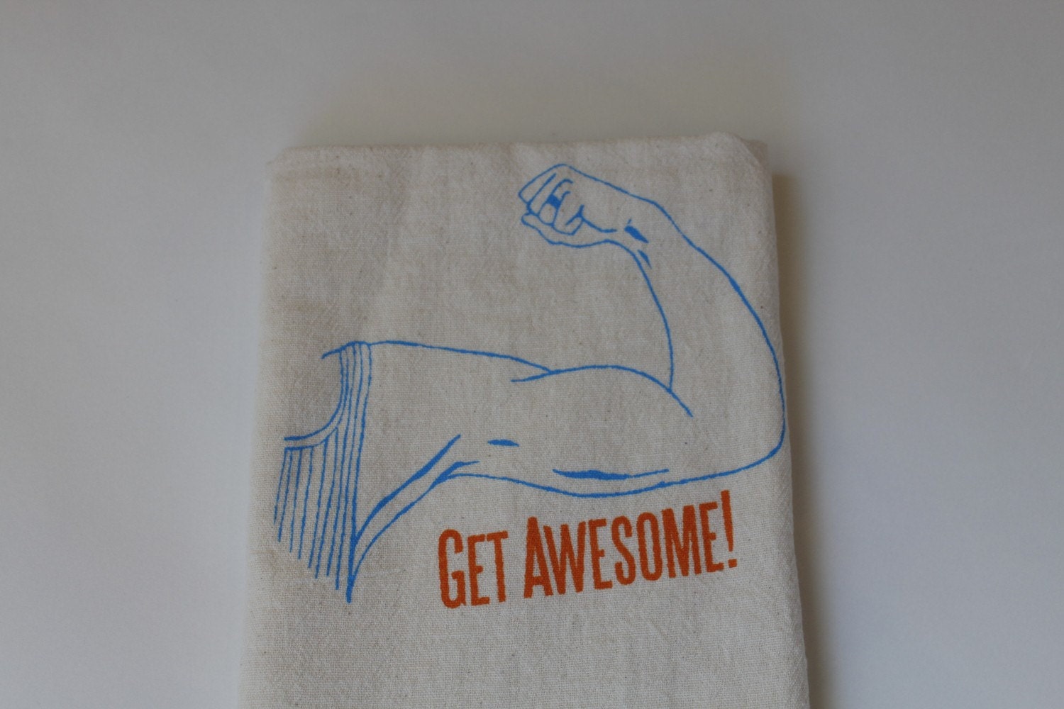 The Heated Get Awesome Dishtowel on Natural