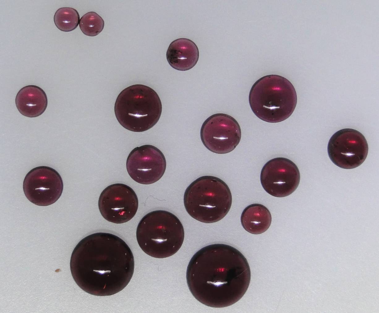Almandite Garnet round cabochons, 17 in lot, range from 3-8mm each 028-17-008