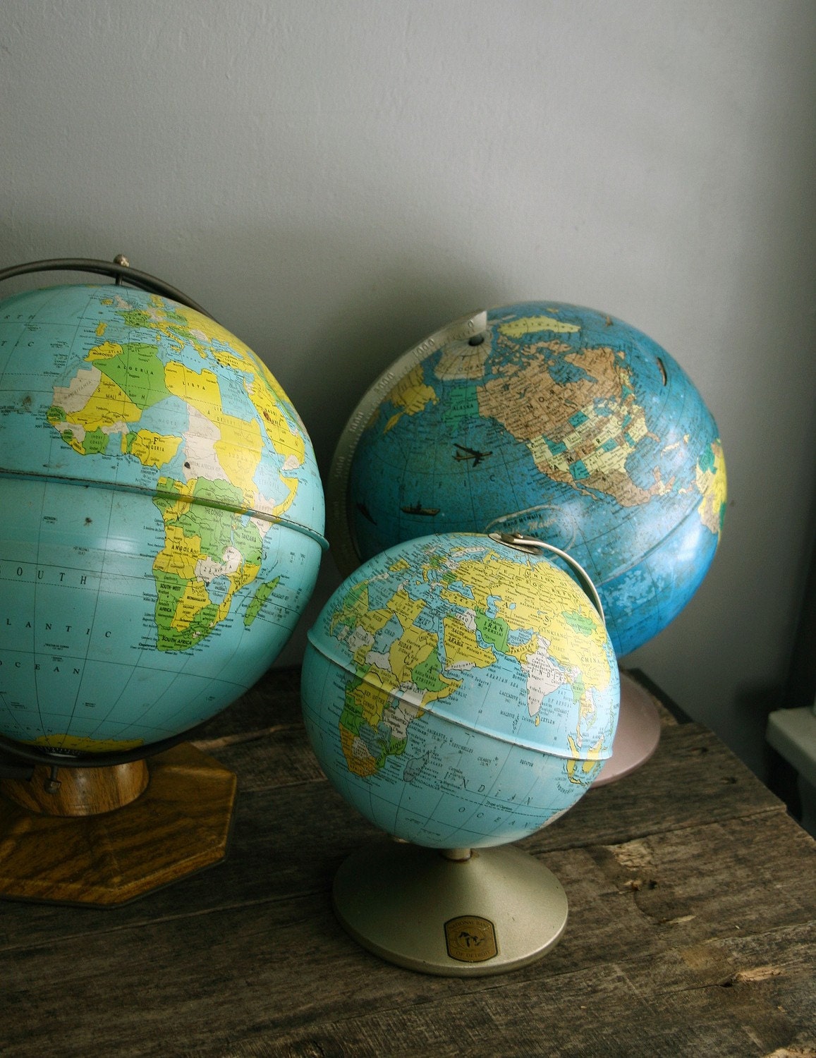 set of three vintage globes.