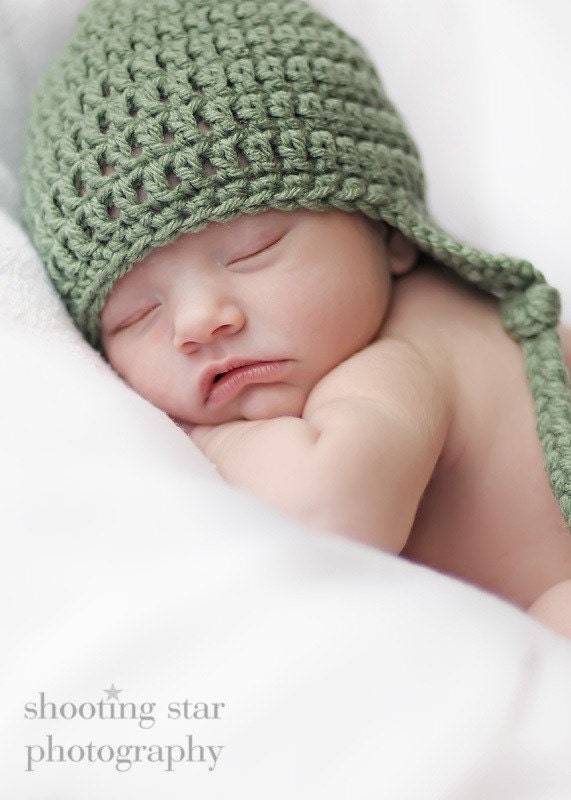 Any-color-but-sage earflap hat sized three to six months