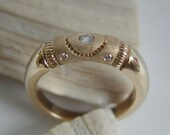 Wedding, engagement ring in gold with five non conflict diamonds. Textured, hammered. Made to order, needs three weeks to complete