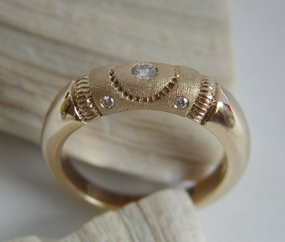 Wedding, engagement ring in gold with five non conflict diamonds. Textured, hammered. Made to order, needs three weeks to complete