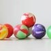 1980s vintage rainbow swirl colored gumball rubber balls--display, toy, art supplies