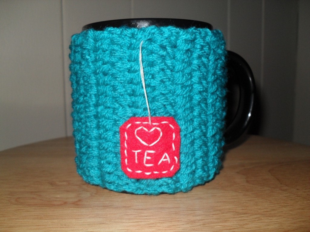 handmade crocheted tea mug cozy in peacock blue with red felt hand embroidered tea bag