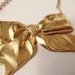 Ribbon bow Necklace, gold ribbon necklace, golden bow necklace with a dangling pearl drop