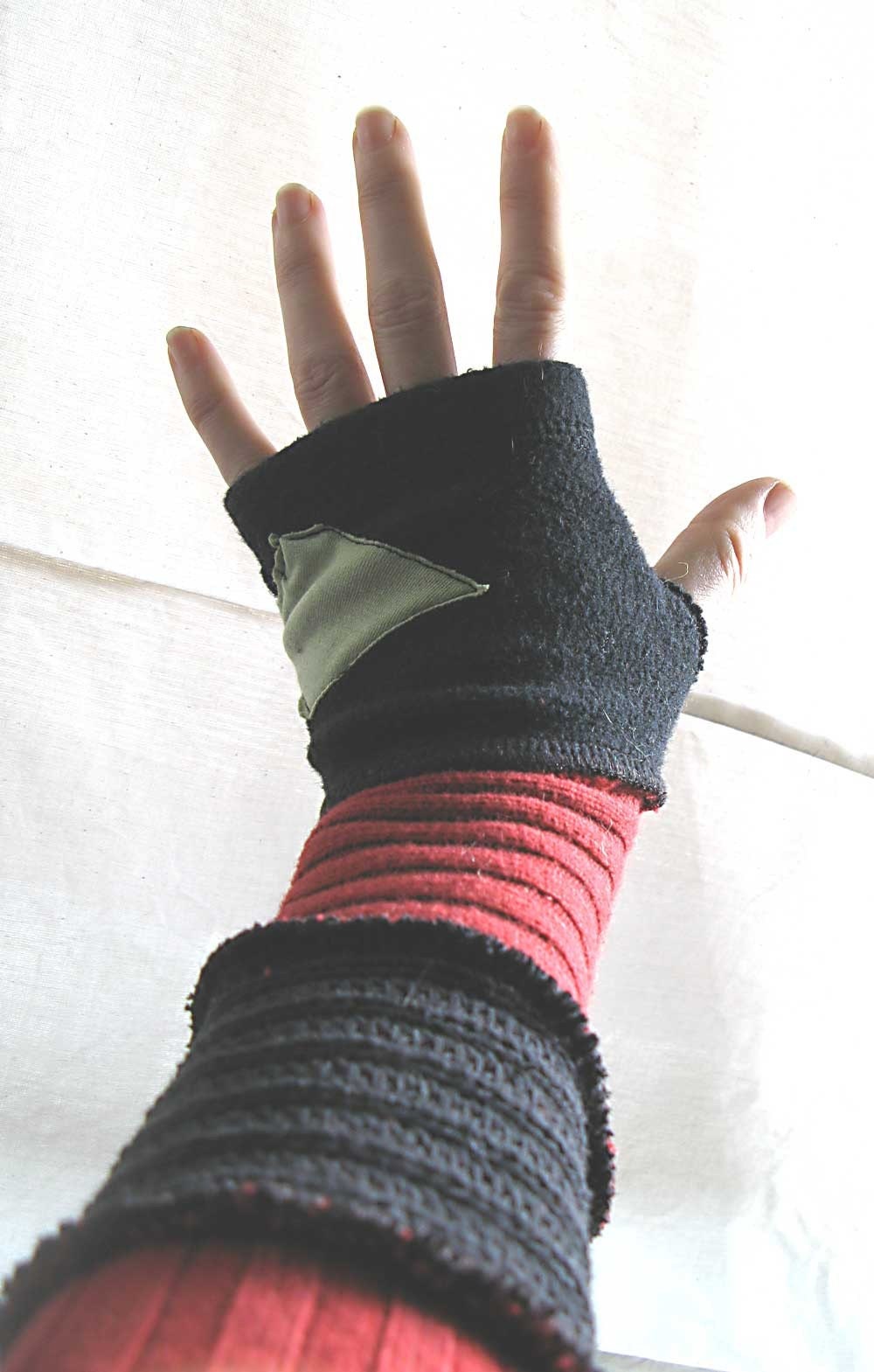 green triangle\/red and black arm warmers