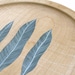 sycamore wood plate // handpainted design // three feathers by natasha newton