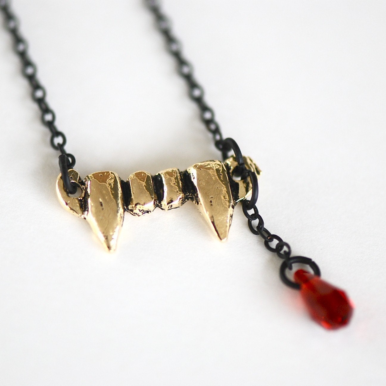gold vampire fang - swarovski crystal - black necklace