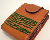 leather wallet with green tree