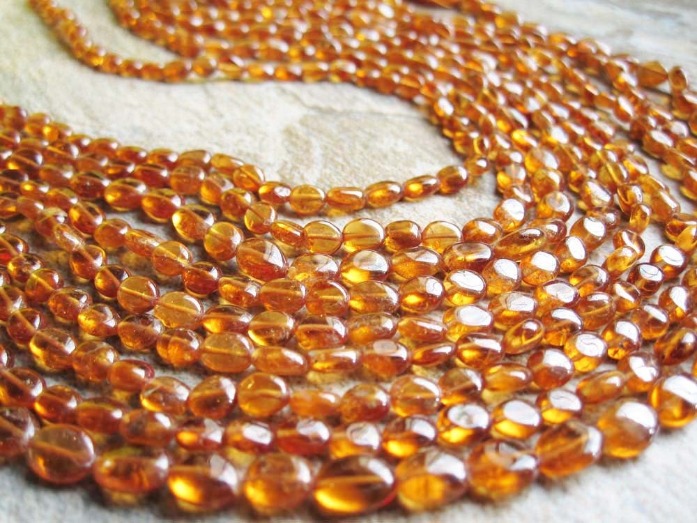Golden Fanta Orange aka Spessartite Garnet Smooth Oval Full strand