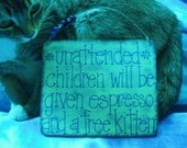 unattended children will be given espresso and a free kitten - wood sign in cream with blue lettering