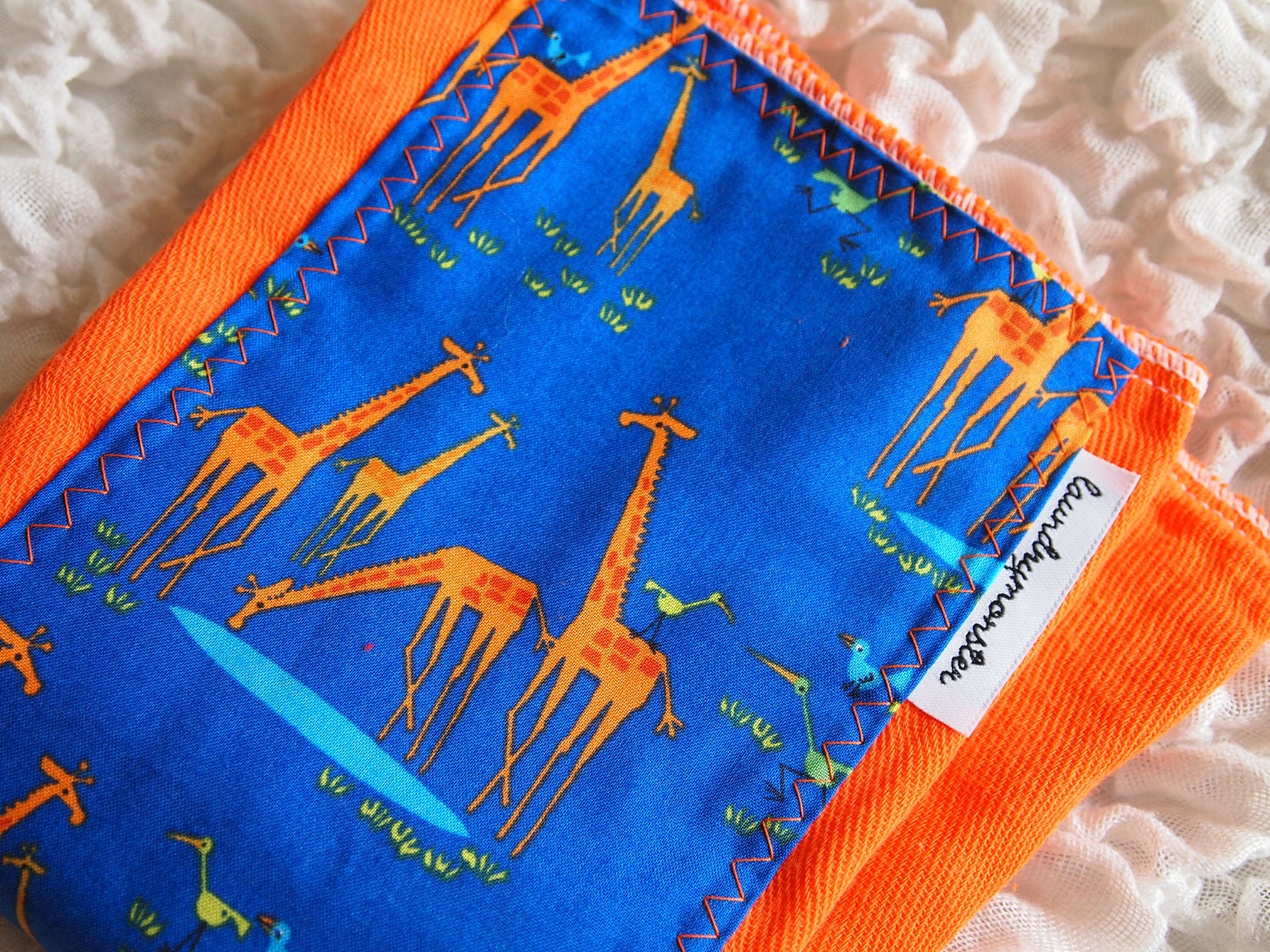 Baby burp cloth - Ed Emberley giraffes on bright orange hand dyed burp cloth