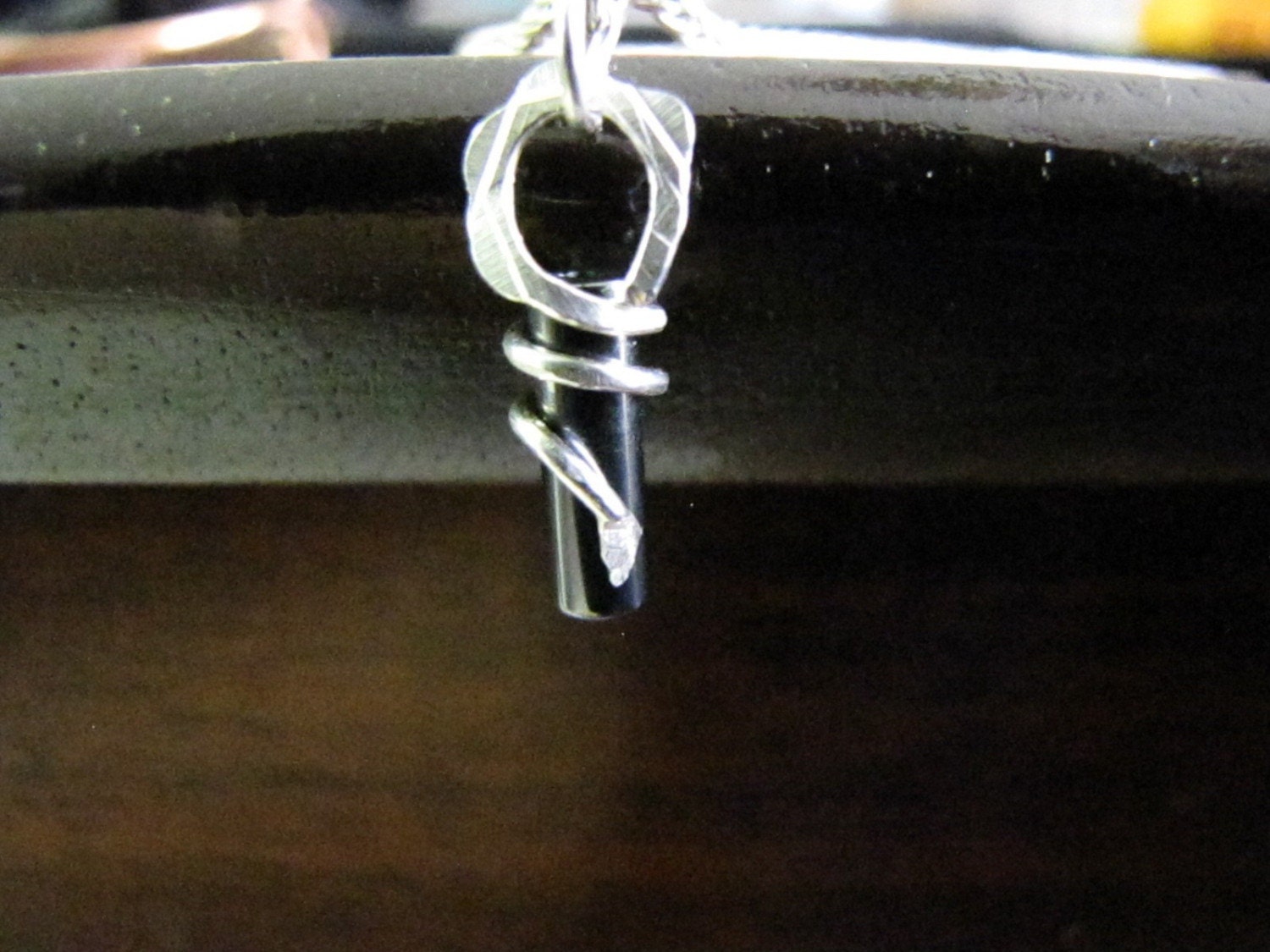Hematite silver wrapped pendant