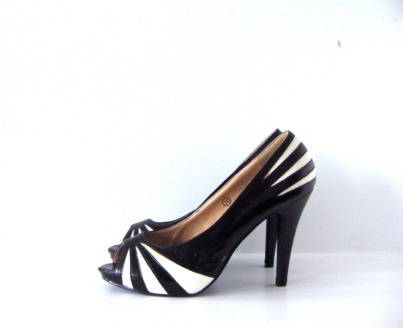 black white geometric heels . 10