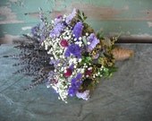 Hand tied bridal bouquet of dried flowers and Lavender with twine covered stems. For a rustic country wedding.