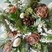 Bridal bouquet made with fresh evergreens and pine cones with birch handle. For your winter woodland natural wedding.