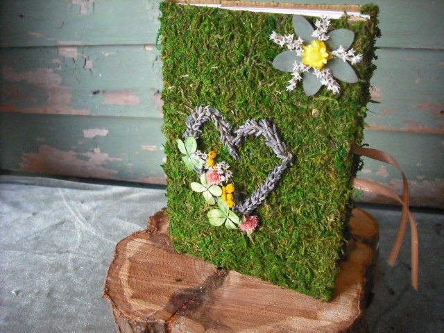 Moss covered journal or guest book. Decorated with dried flowers and heart made from Lavender.