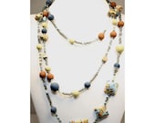 Polymer clay beaded necklace, polymer clay beads mix with glass and metal beads, blue, green, brown