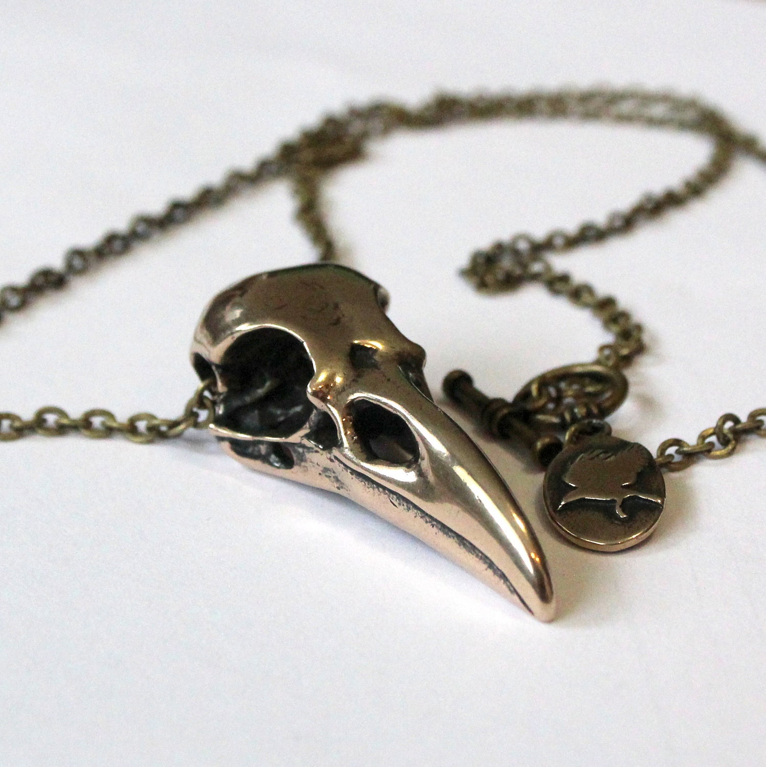Raven Skull Bird Skull Pendant Necklace in Jewelers Grade Bronze