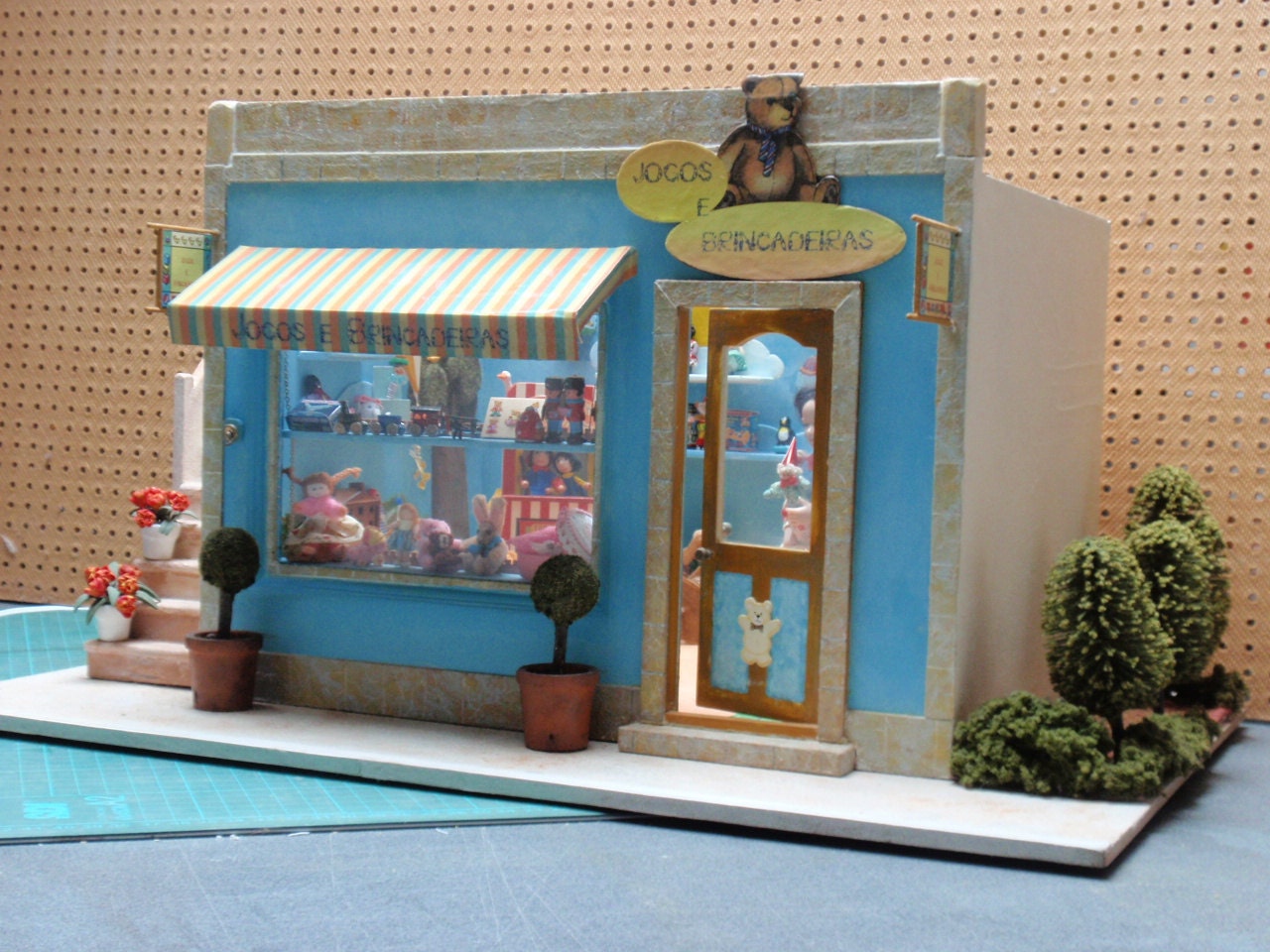 Dollhouse miniature toy shop in 12th scale, full  with toys and  its owner doll OOAK - miniaturesforever