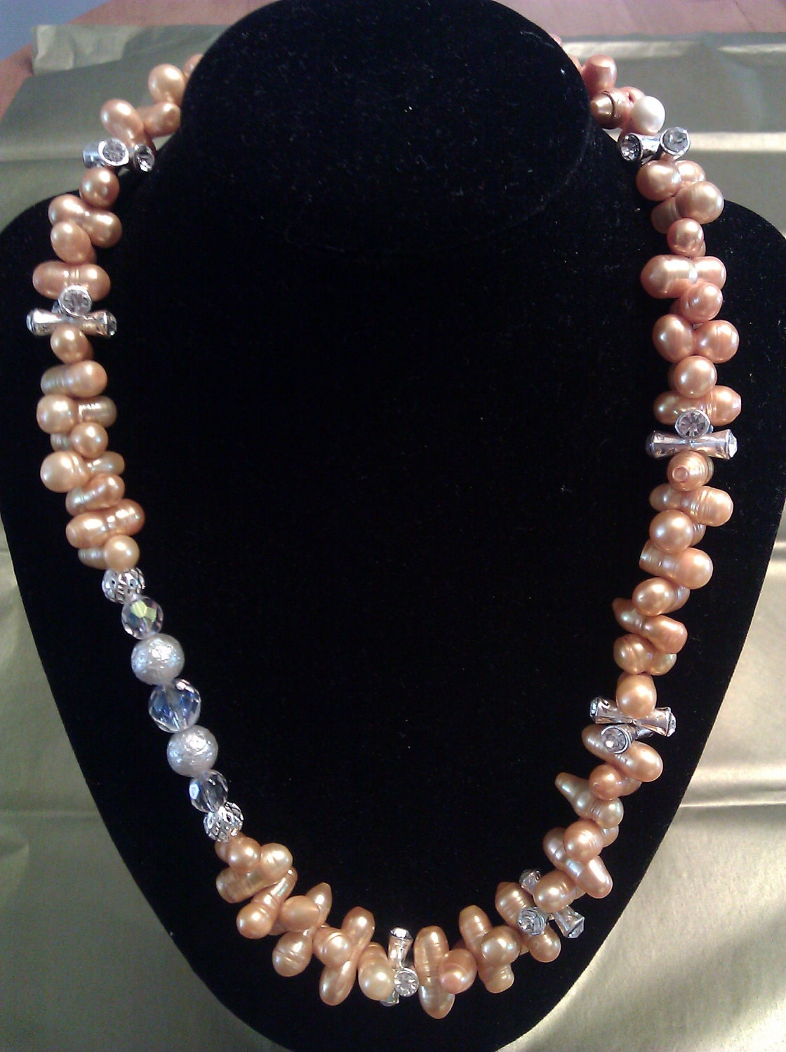 Pearl necklace with swarovski crystal and sterling silver beads.