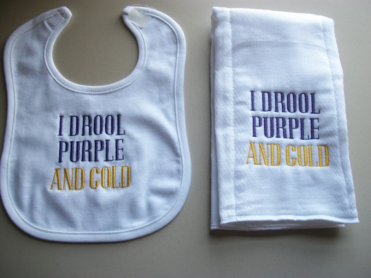 I drool purple and gold burp cloth and bib set