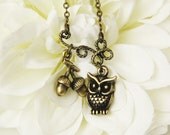 owl charm necklace . bronze . the owl contemplates the acorn