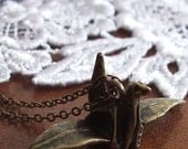 paper crane necklace . bronze