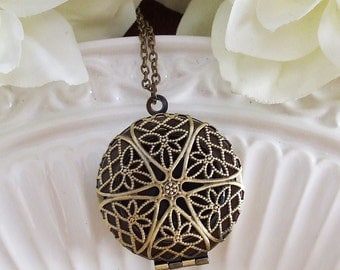filigree locket necklace . bronze