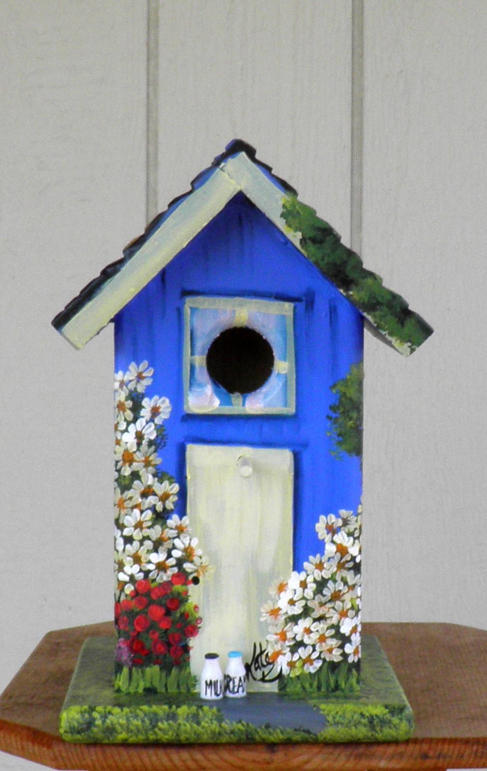 Outdoor Bird House, Handcrafted and Hand Painted, Yard or Home Decoration Painted Blue with lots of Flowers and a Car in the Garage