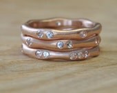 Water Rings in 14 Karat Rose Gold with Moissanite
