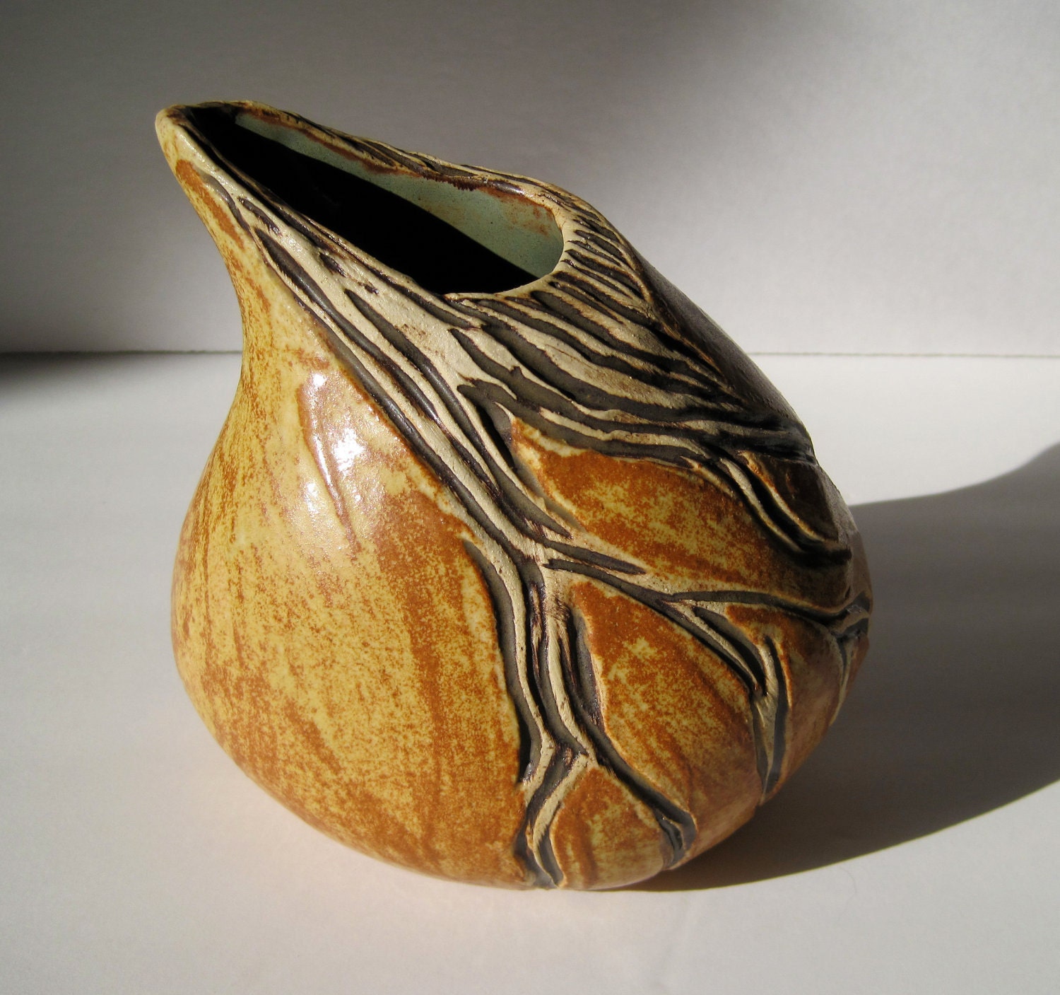 small gold carved vase