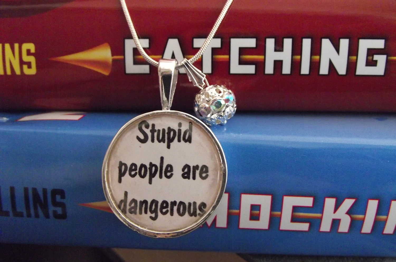 Stupid people are dangerous- Hunger Games- buy two get one free- includes a 16" or 18" snake chain- READY TO SHIP